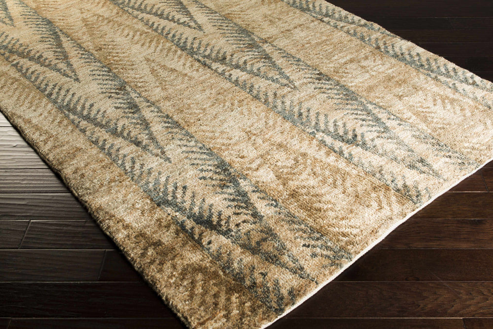 Hand-knotted jute rug with layered abstract brown, beige, and blue-gray stripes