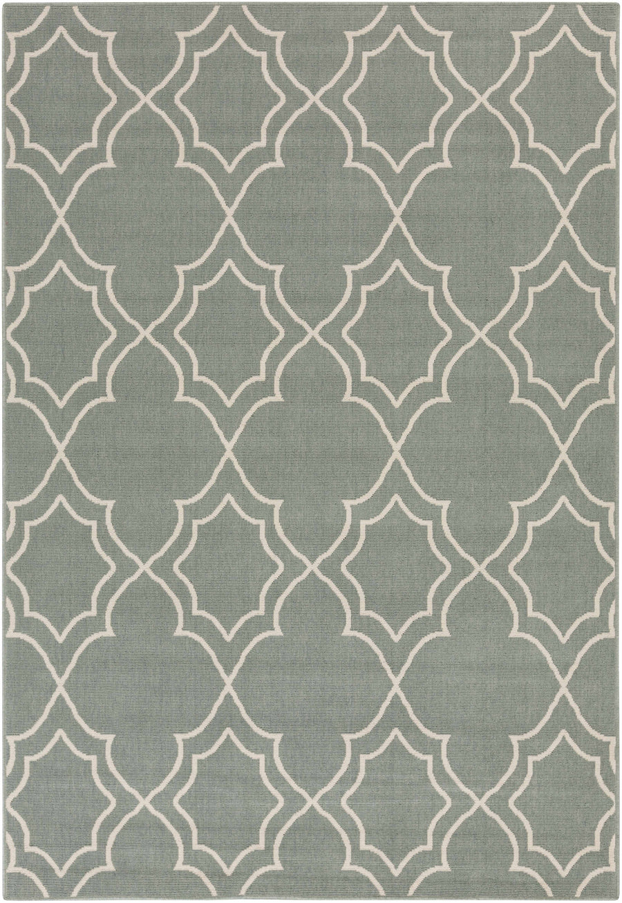 Green area rug with repeating beige trellis quatrefoil geometric pattern