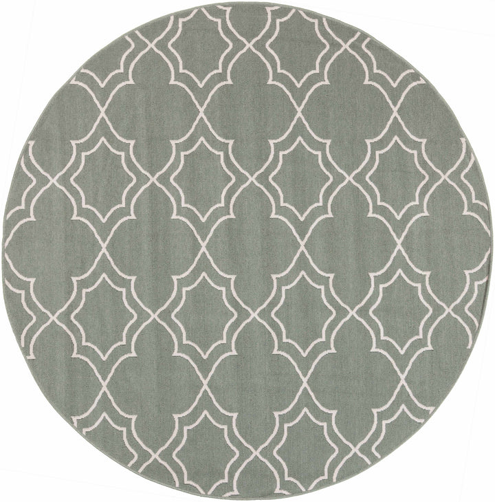 Round green area rug with beige trellis quatrefoil pattern and stitched border