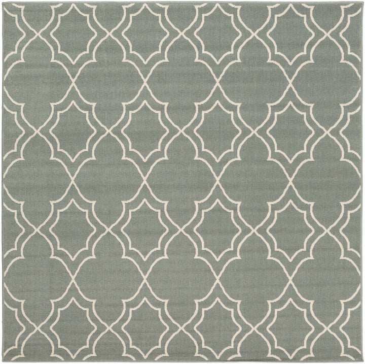 Square green area rug featuring a beige trellis quatrefoil geometric design