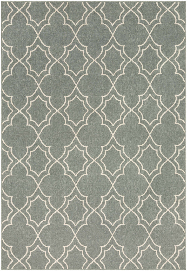 Rectangular green area rug with beige lattice quatrefoil pattern filling the surface