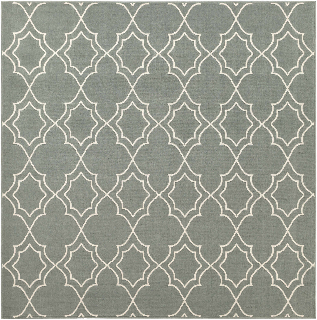 Large green area rug with repeating beige trellis quatrefoil geometric motif