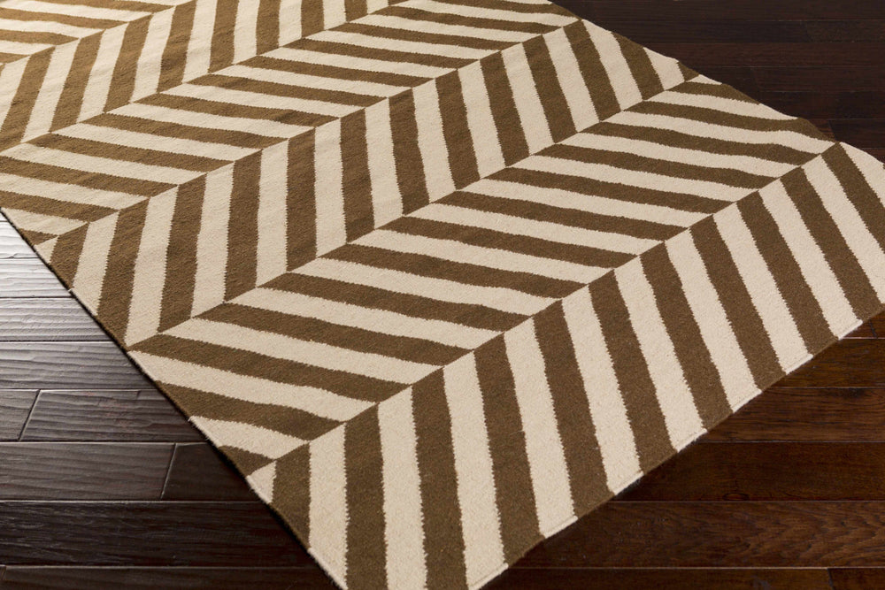 Brown and beige chevron area rug with bold diagonal stripe pattern, corner view.