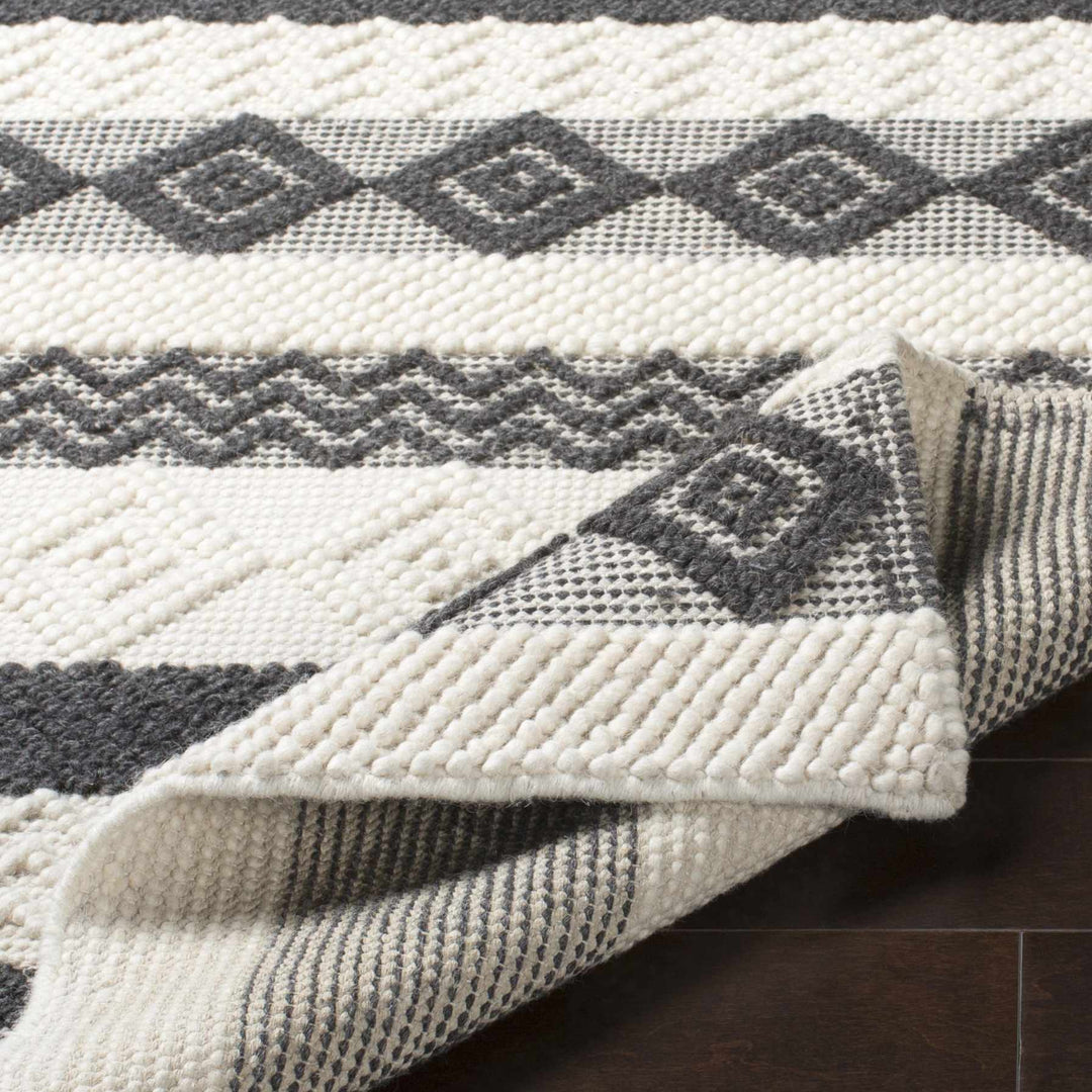 Hand Woven Tribal look Ivory and Charcoal Geometrical Tasseled wool Area Rug - The Rug Decor