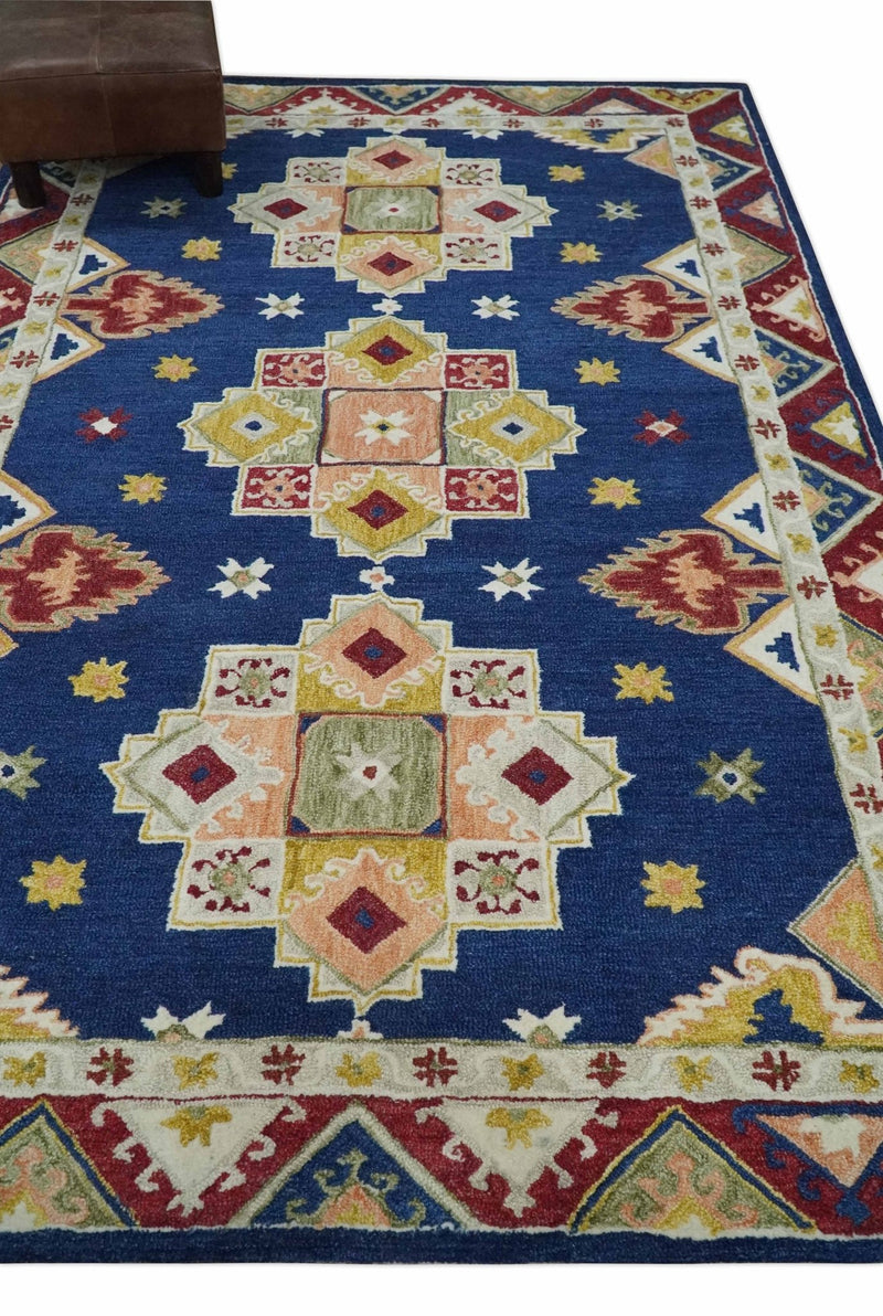https://therugdecor.com/cdn/shop/products/multi-size-hand-tufted-blue-ivory-and-rust-traditional-antique-style-wool-rug-281253_800x.jpg?v=1688835284