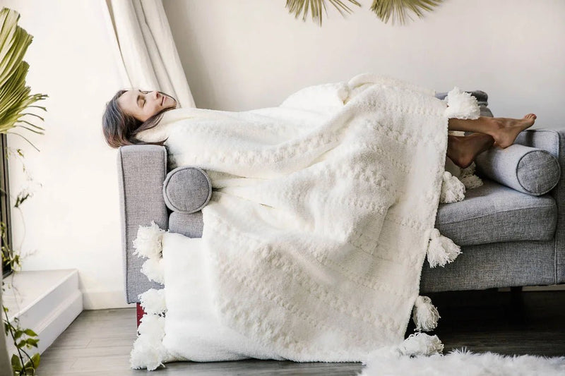 Soft And Cozy Black, White and Tan Tassel Braided Pom Pom Throw - The Rug Decor