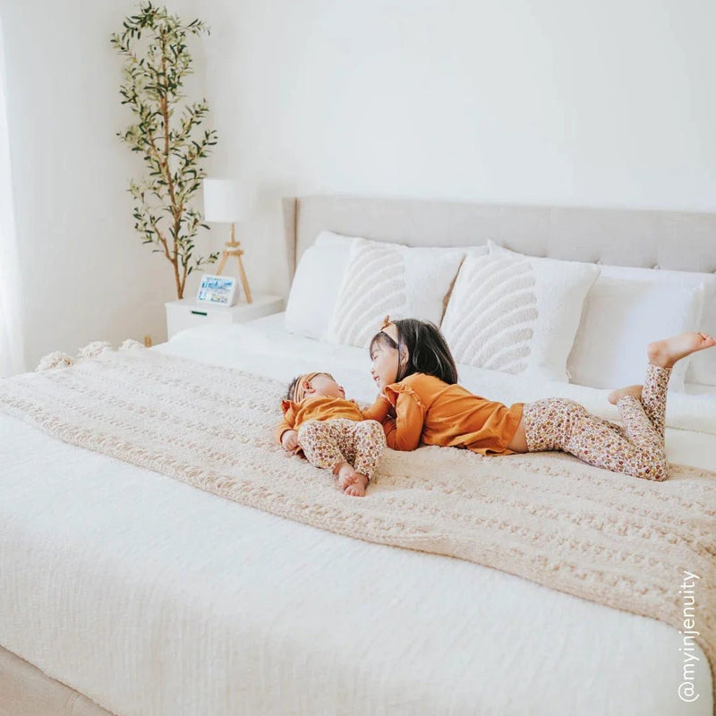 Soft And Cozy Black, White and Tan Tassel Braided Pom Pom Throw - The Rug Decor