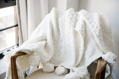 Soft And Cozy Black, White and Tan Tassel Braided Pom Pom Throw - The Rug Decor