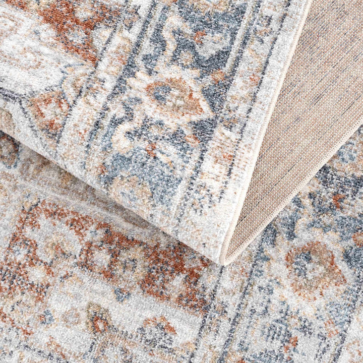Traditional Heriz Ivory, Rust and Blue Medallion Design Low Pile Washable Area Rug - The Rug Decor